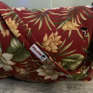Red color dog bed bag with prints of green leaves and different colored flowers