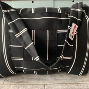 Black dog bed bag with white stripes on it and a tag of DoggyToGo