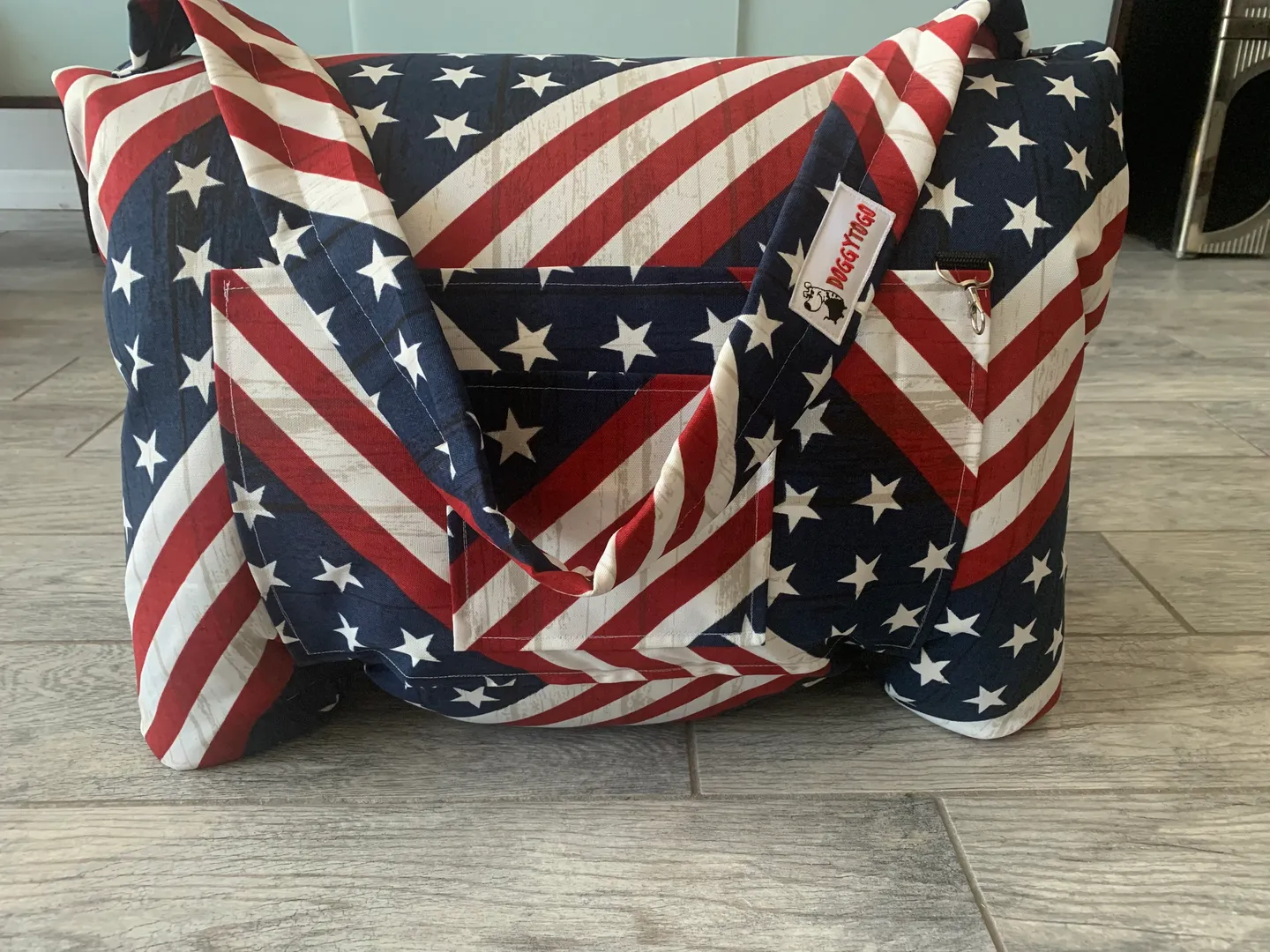 A dog bed bag with the pattern of the United States of America flag printed on it
